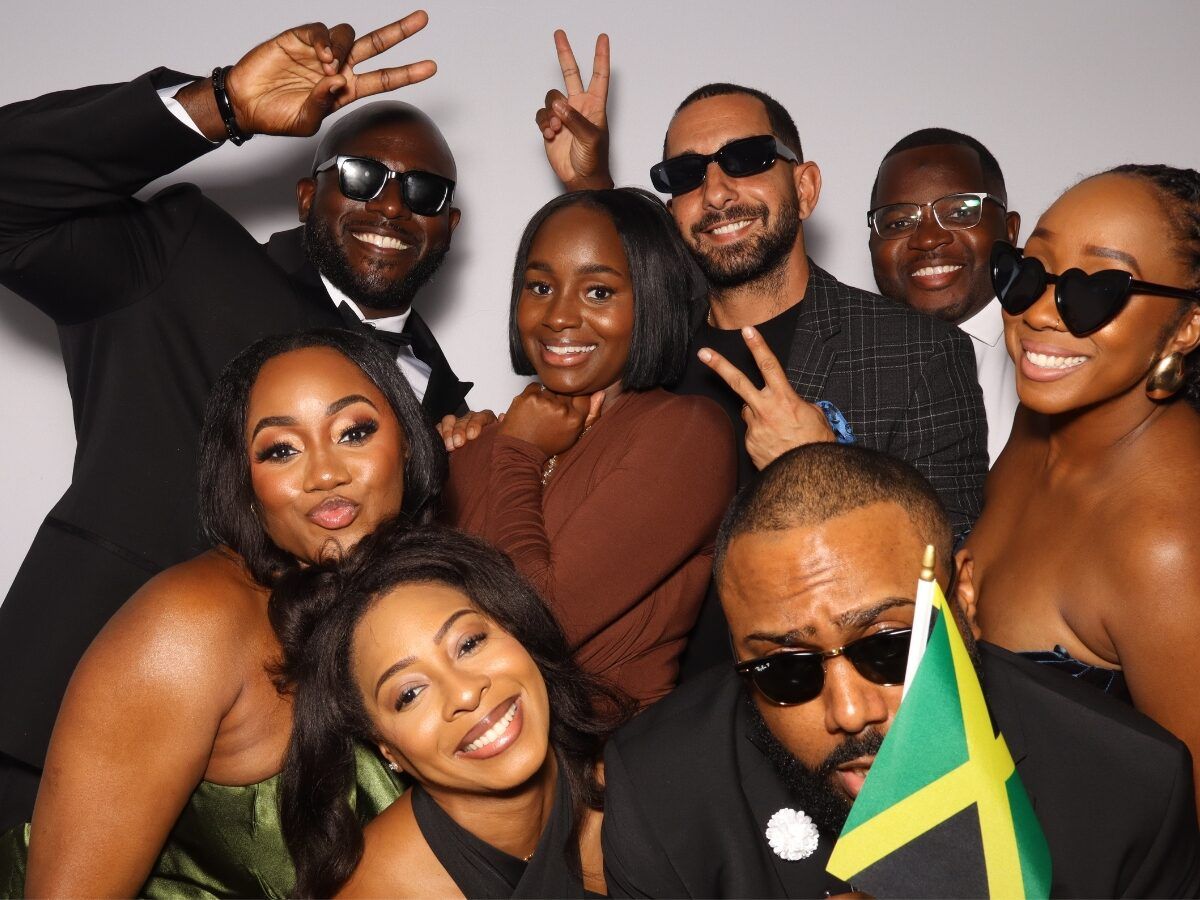 Guests smiling in the open-air photo booth
